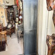 Black painted wardrobe with two glass doors and an interior sideboard.