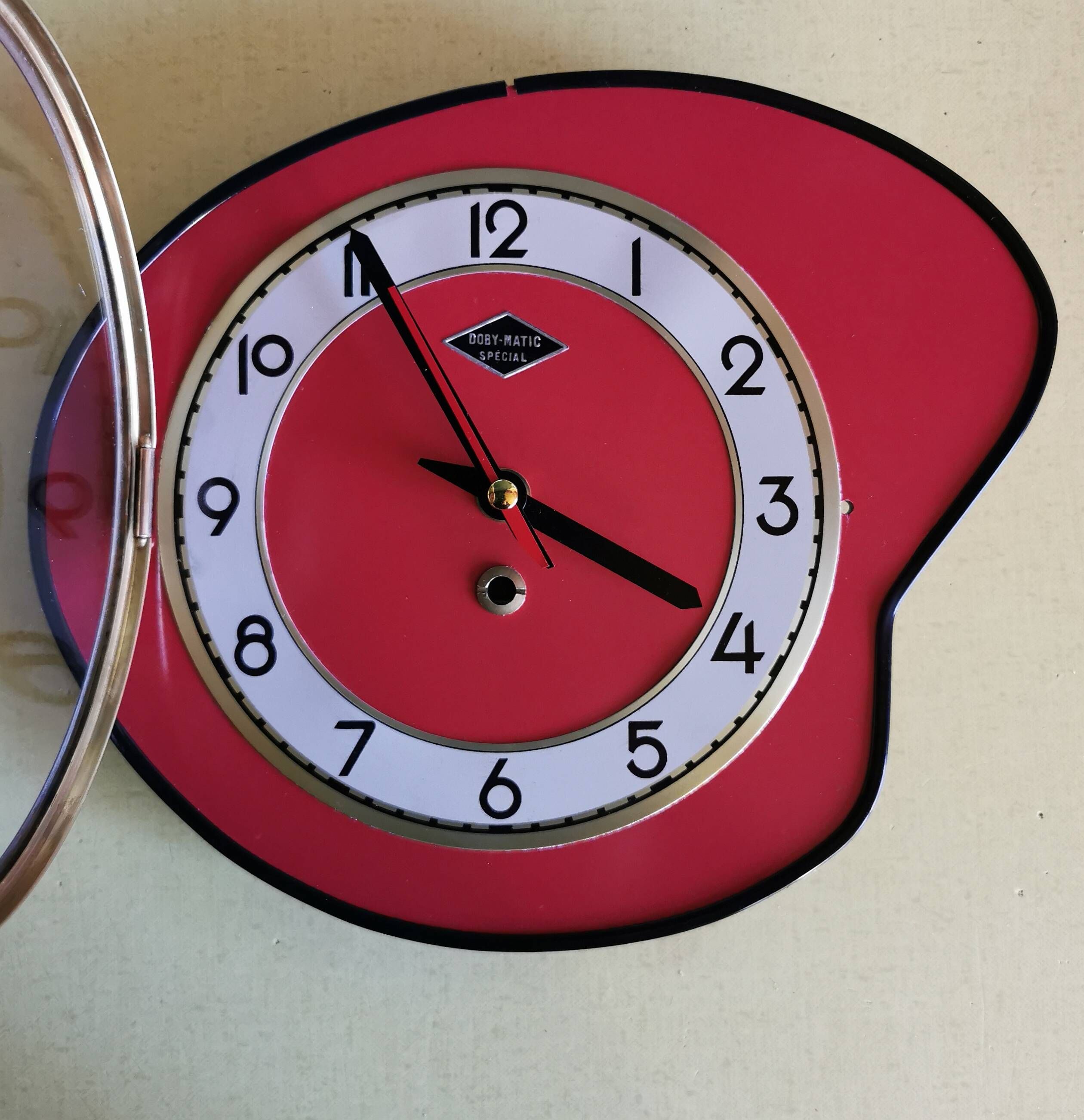 Vintage formica clock silent asymmetrical wall pendulum "Doby Matic red"