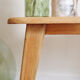 Oak coffee table with compass feet