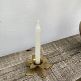 Old golden brass candle holder in the shape of a leaf or flower