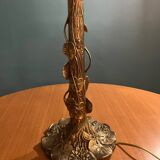 Brass foot table lamp with Tiffany style decor
