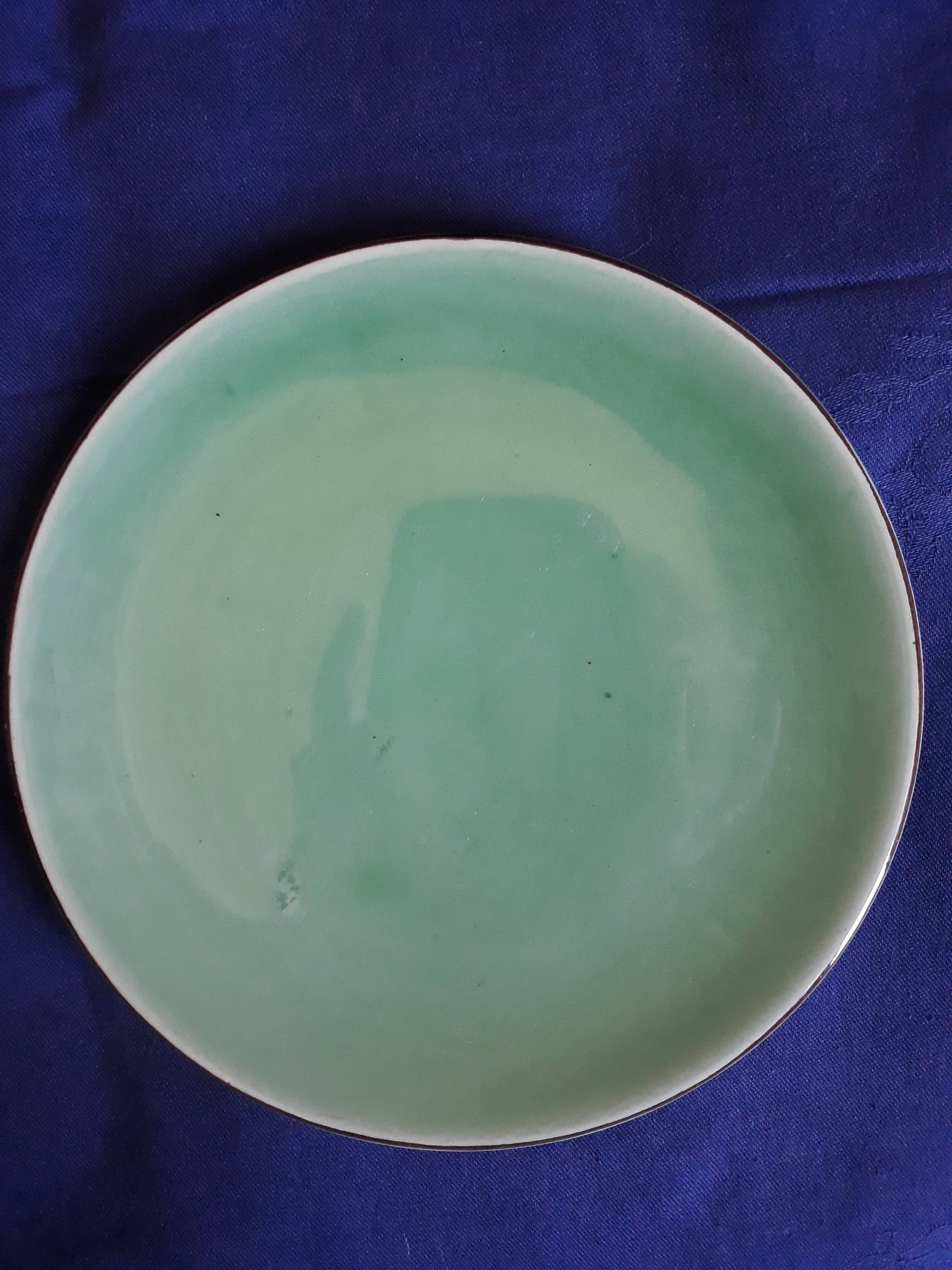 10 green ceramic plates signed "Georges" VALLAURIS