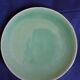 10 green ceramic plates signed "Georges" VALLAURIS