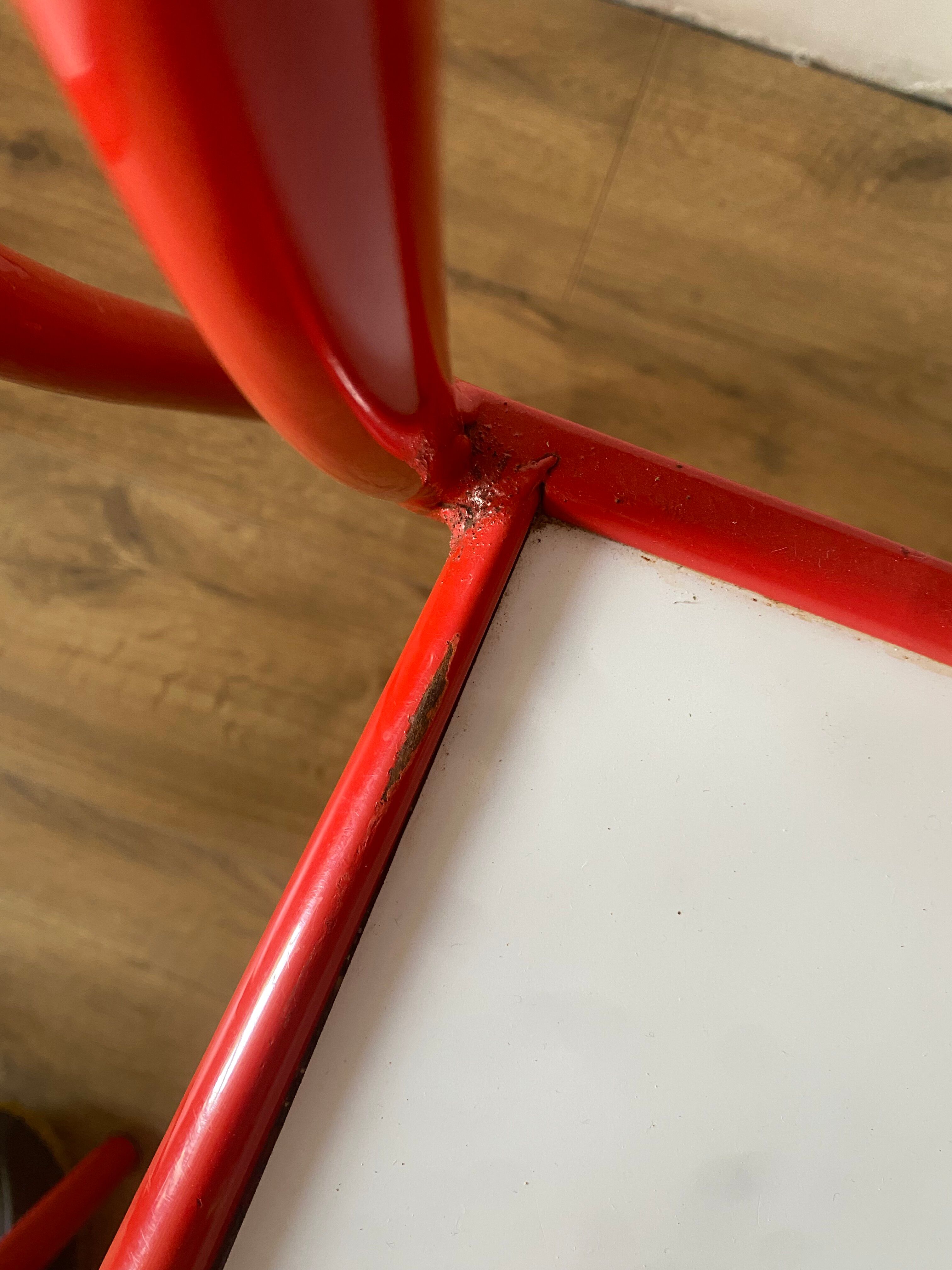 4 red metal chairs by Mallet-Stevens