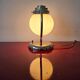 Art Deco table lamp with a spherical opaline glass shade and chrome base from the 1930s.