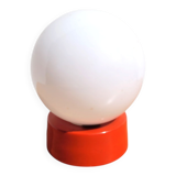 Small vintage opaline ball lamp with an orange base.