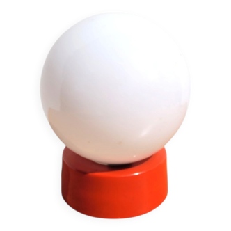 Small vintage opaline ball lamp with an orange base.
