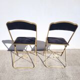 Pair of black and gold folding opera chairs