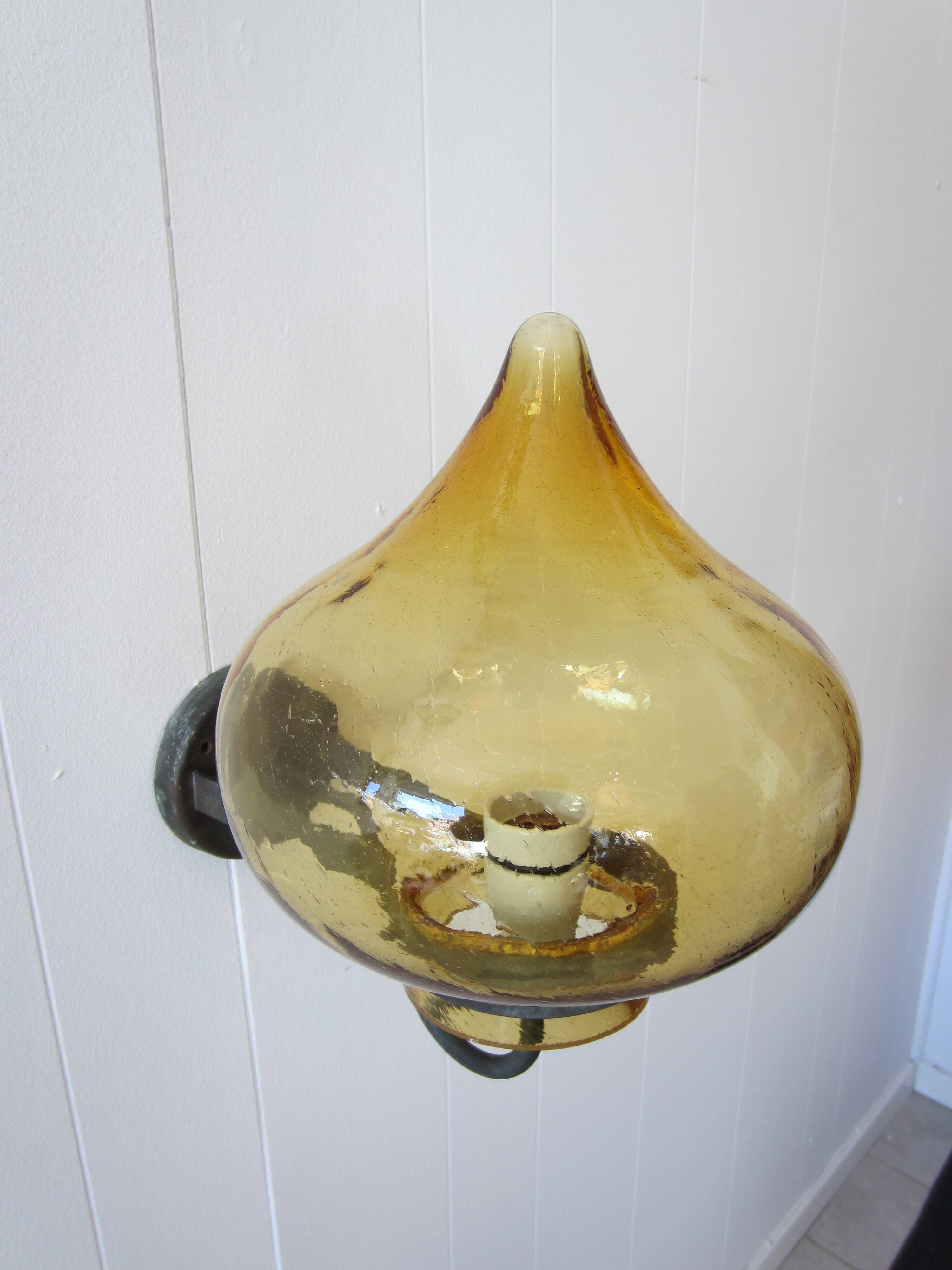 Scandinavian outdoor wall light in copper and amber glass