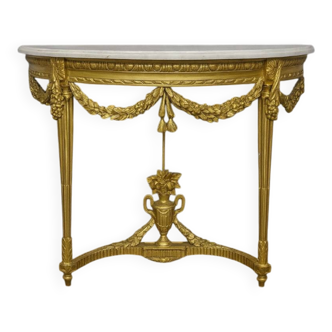 Louis XVI style demi-lune console, carved wood and gilded with gold leaf.