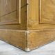 Wooden hardware cabinet painted with wood effect, circa 1940.