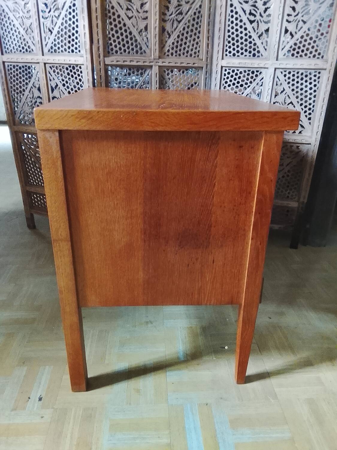 Vintage storage unit with two doors and four drawers.