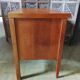 Vintage storage unit with two doors and four drawers.