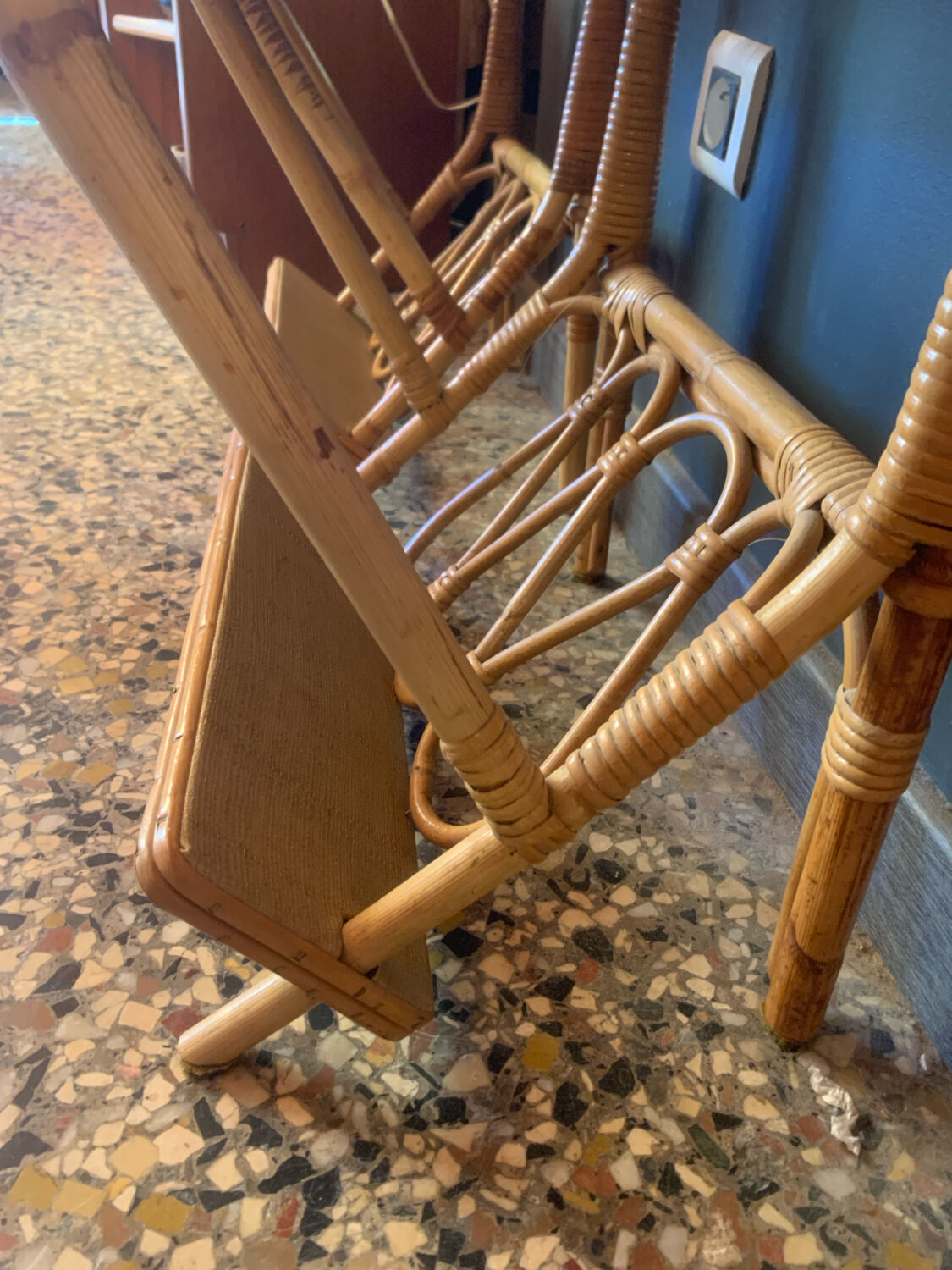 A pair of rattan bedside tables.