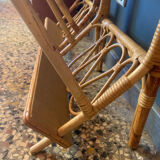 A pair of rattan bedside tables.