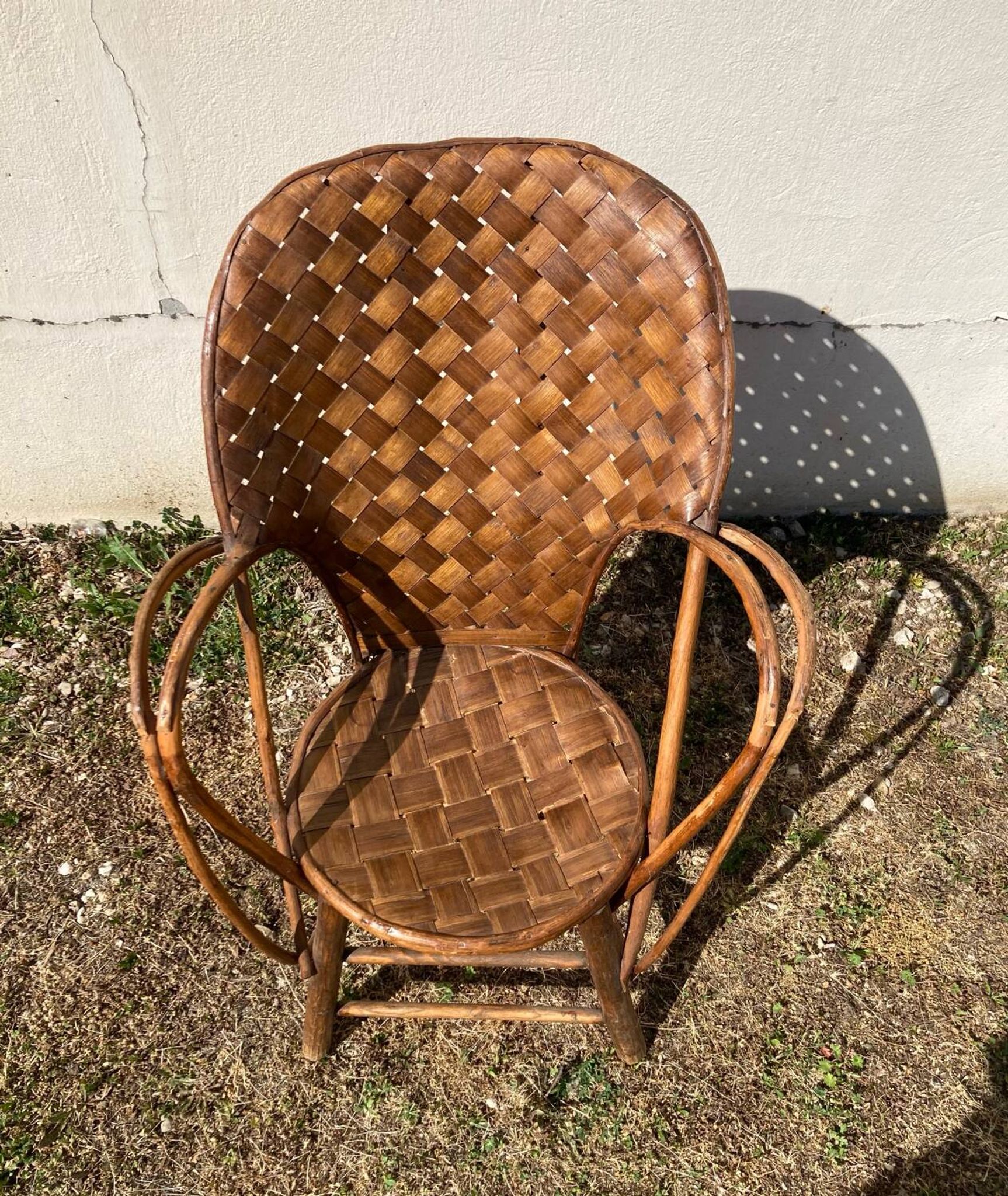 Vintage 1970s armchair in curved woven chestnut + seat cushion