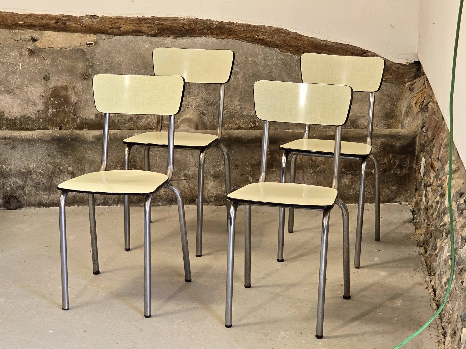 Set of 4 light yellow formica chairs