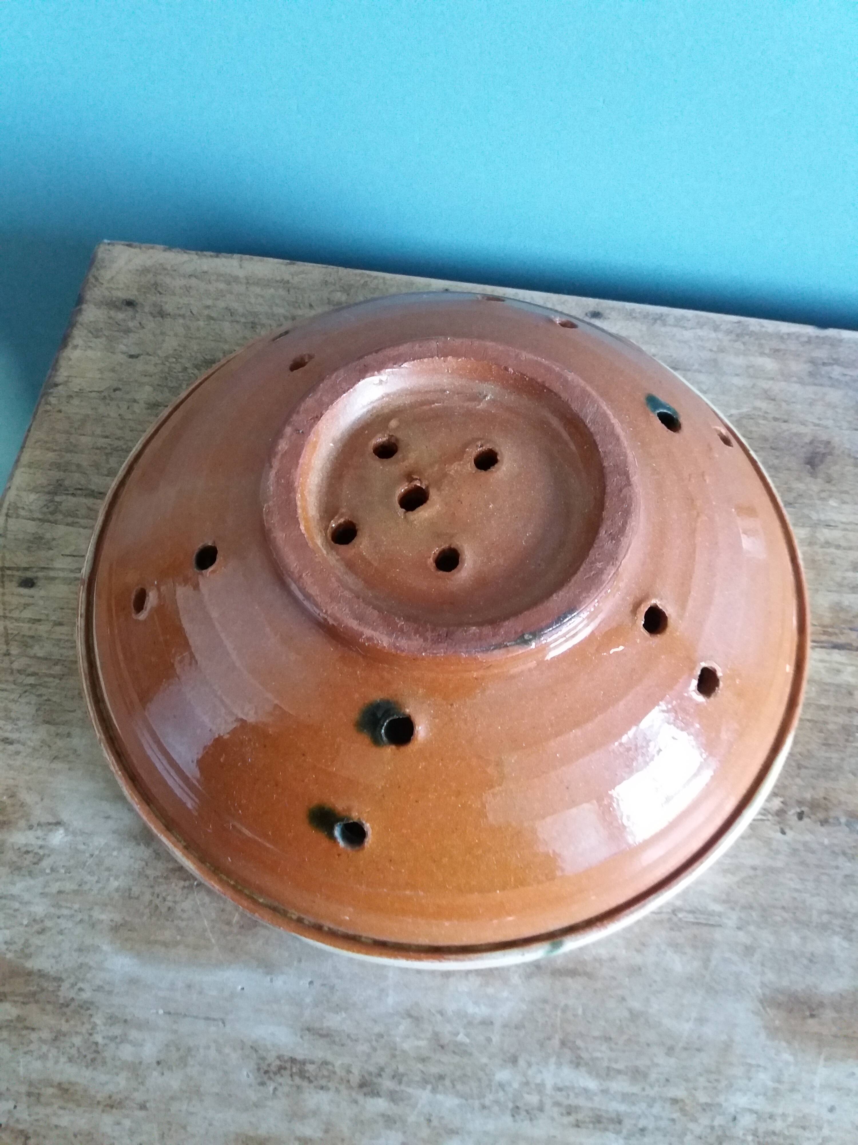 Glazed terracotta fruit bowl strainer