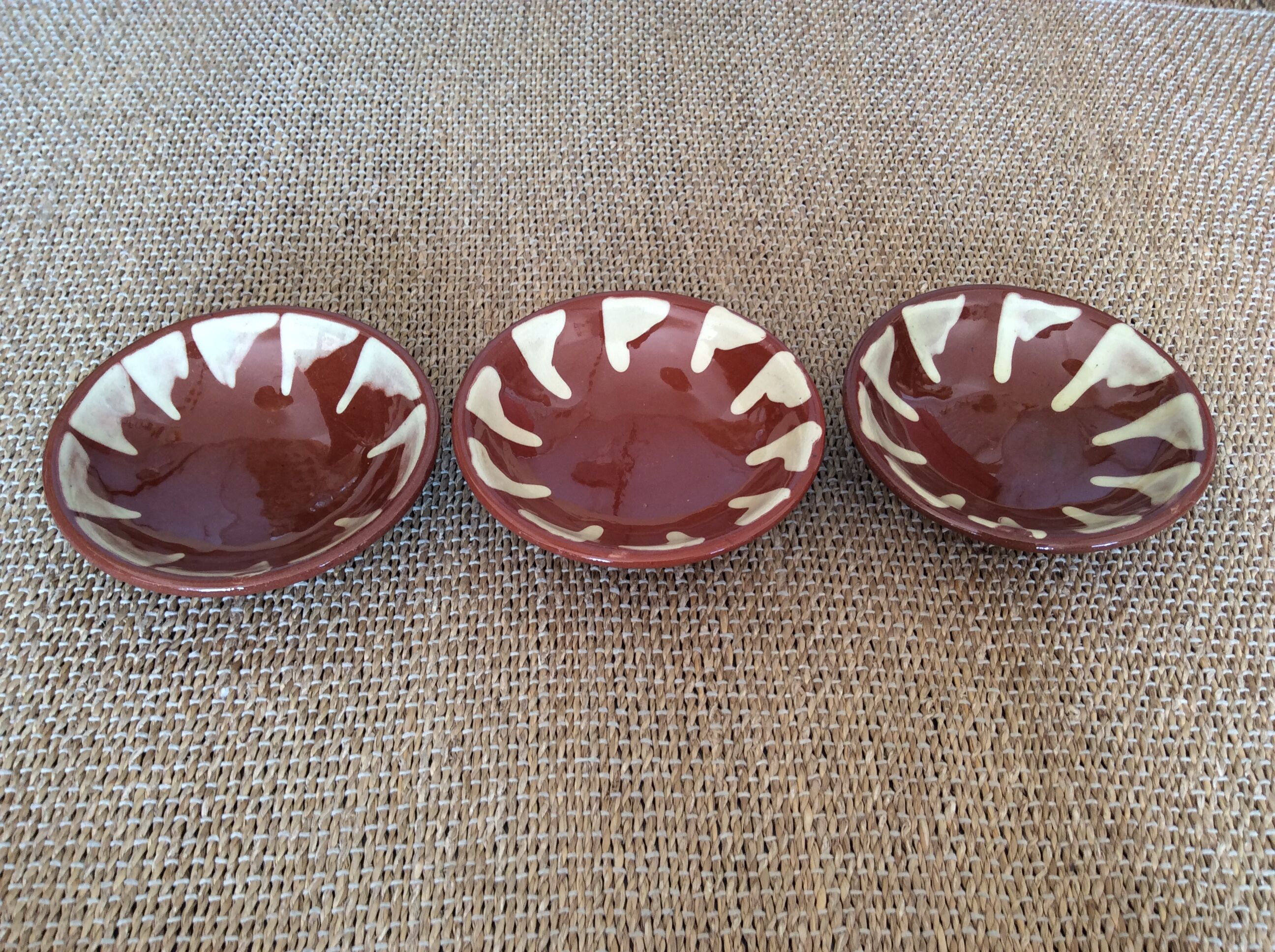 3 glazed terracotta plates