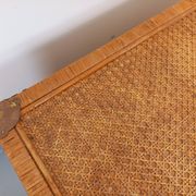 Vintage trunk in wood, rattan, caning, and brass.