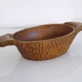 Gouged wooden pocket emptier