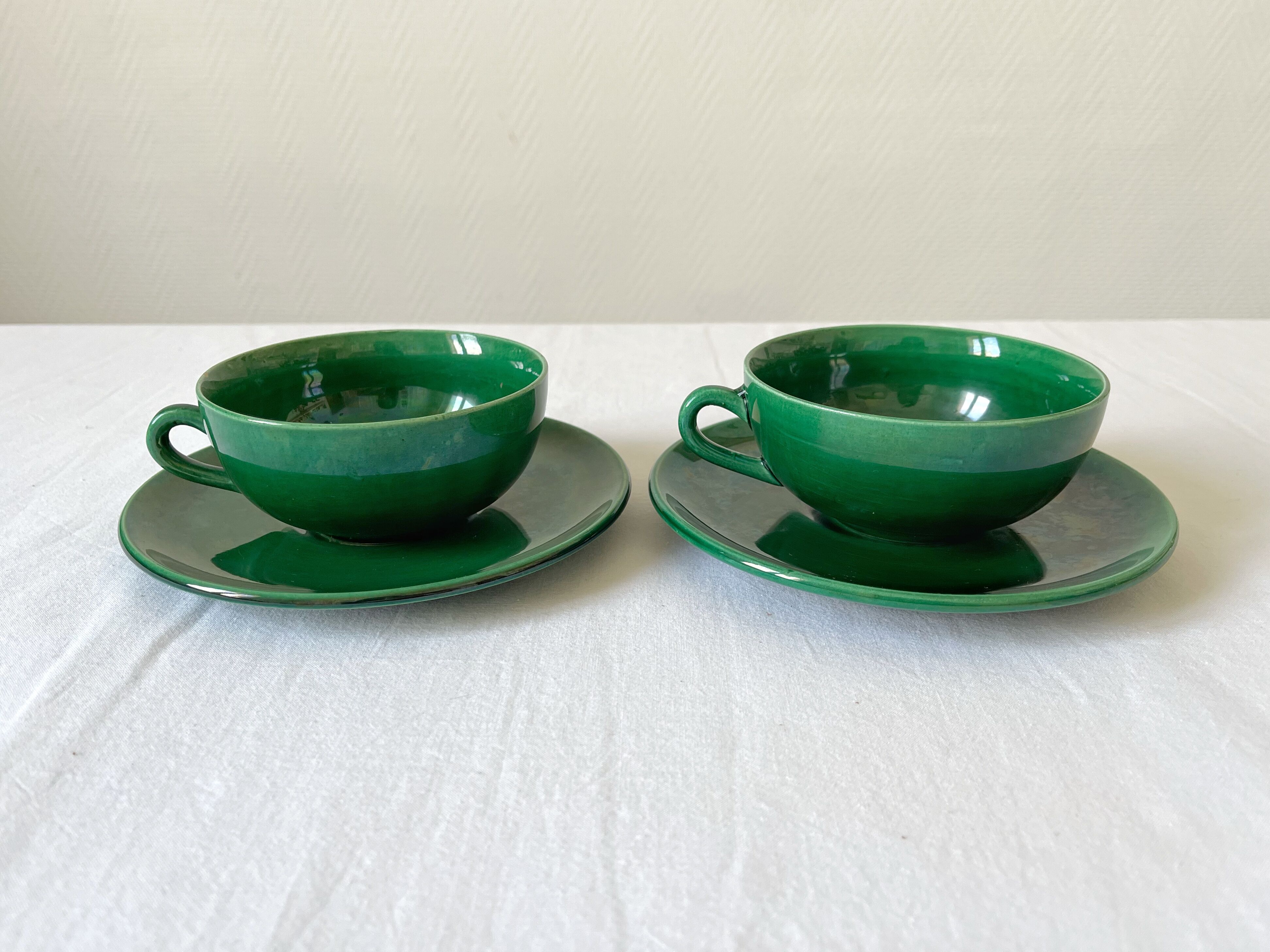 2 old green coffee cups in earthenware of Saint Clement