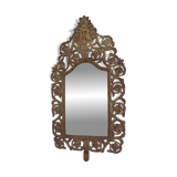 19th century beveled mirror with metal decor