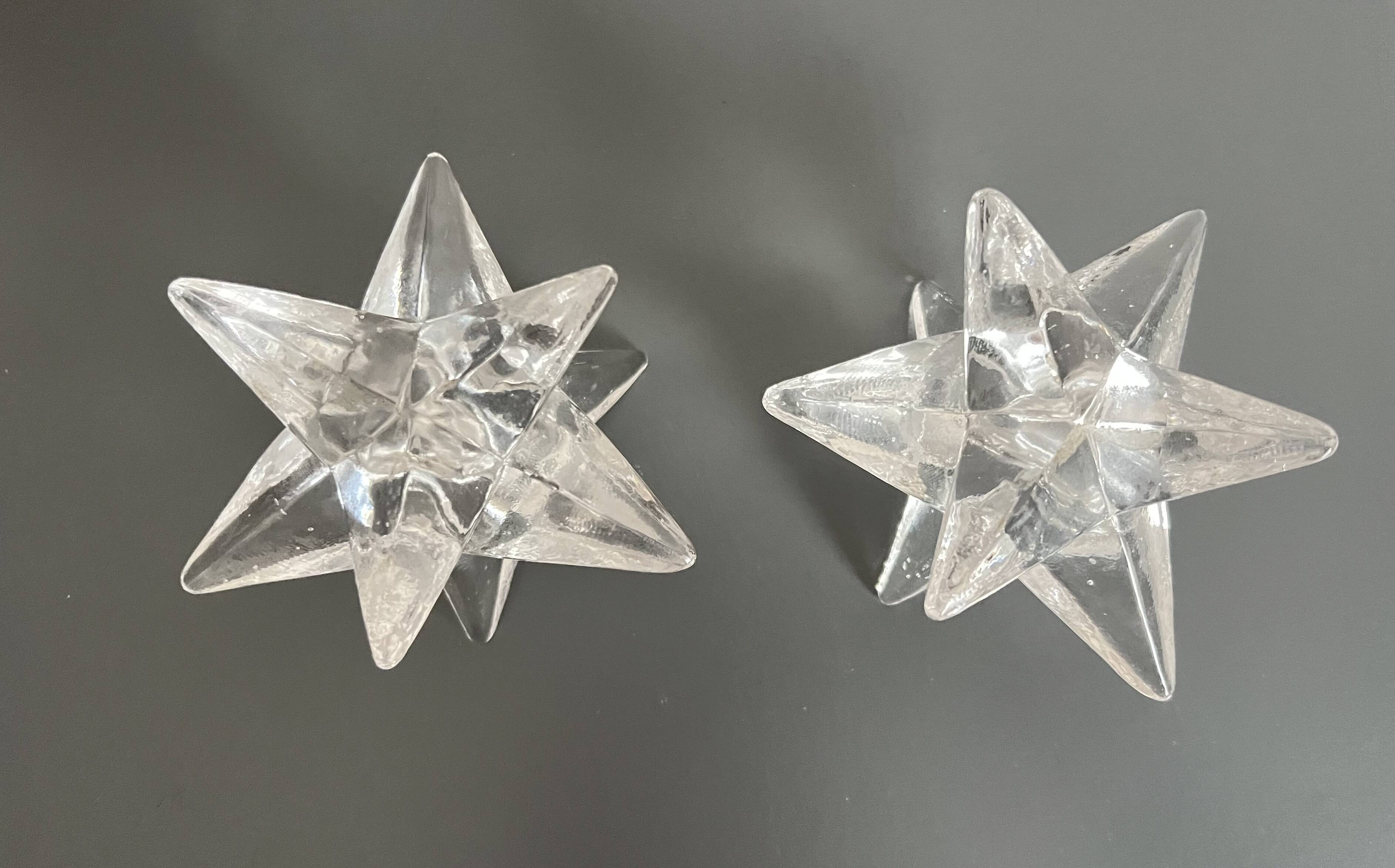 Set of two transparent glass star candle holders