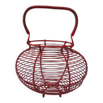 Old red-painted metal egg basket