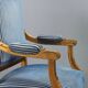 Chairs and antique armchairs in neoclassical style from the 19th century.