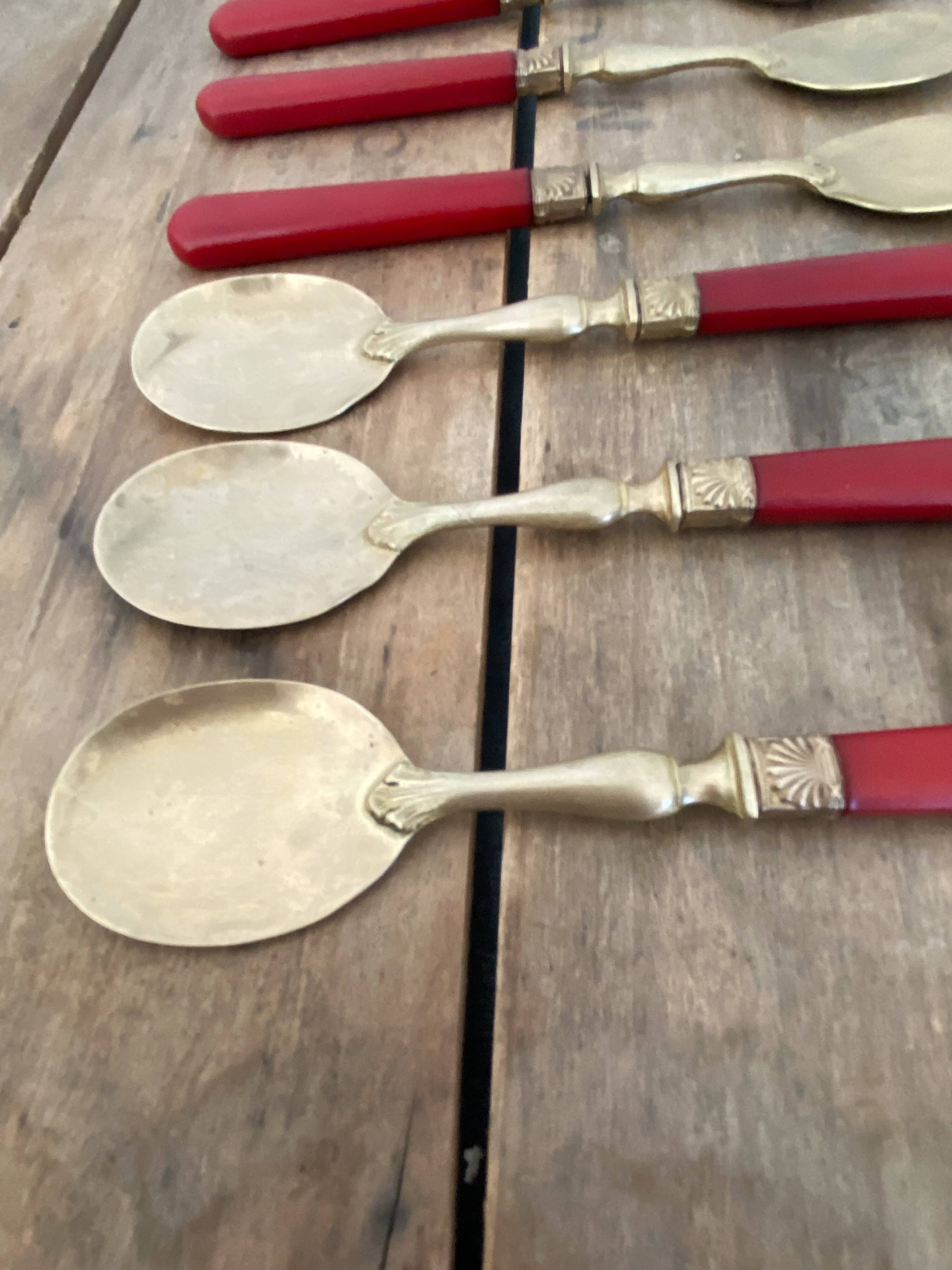 Six cuillères à glace en laiton et bakélite