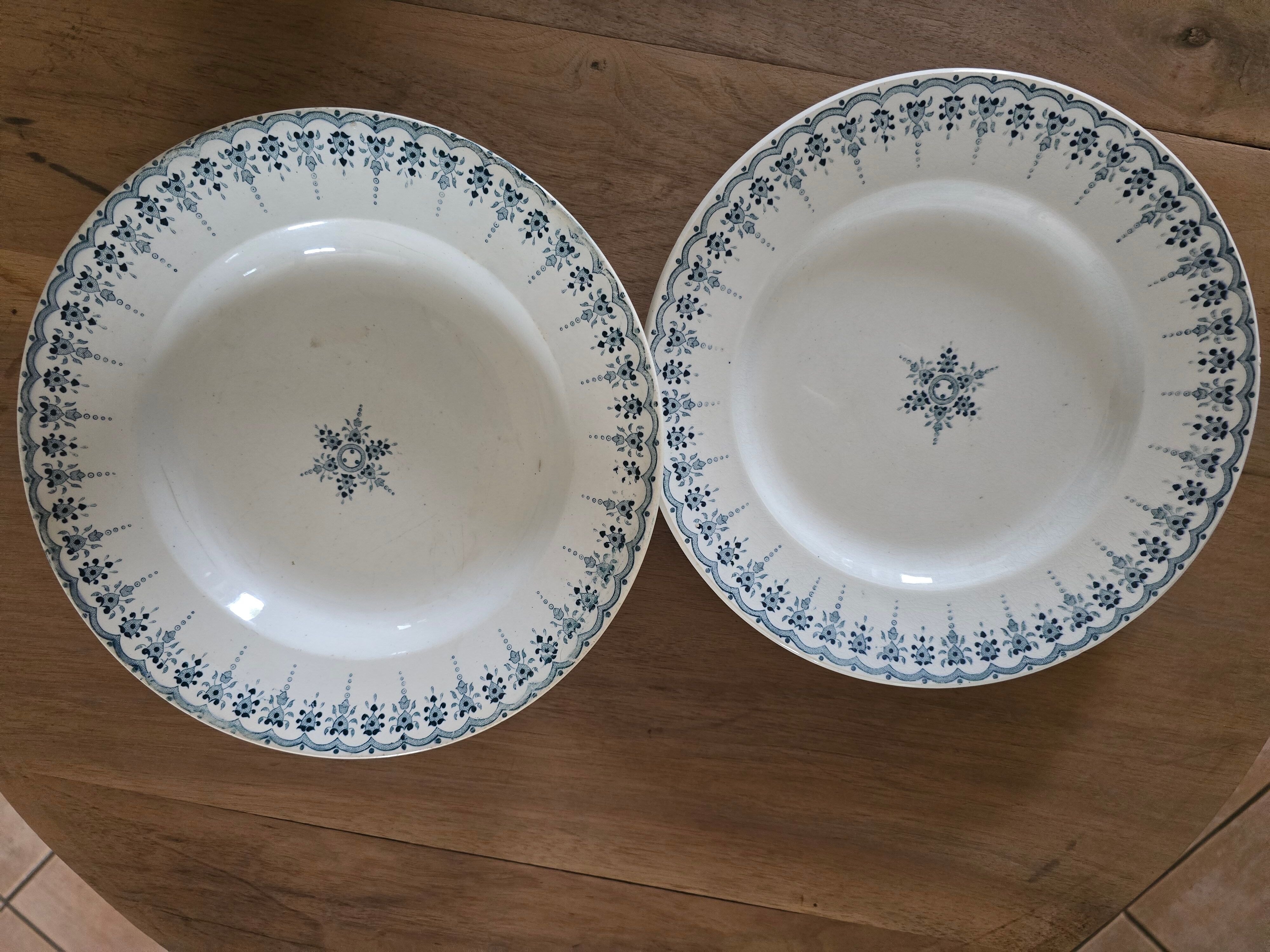 Old green-blue faience plates and dishes with geometric patterns.
