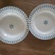 Old green-blue faience plates and dishes with geometric patterns.