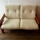 Scandinavian 2-seater bench sofa in teak and wool.