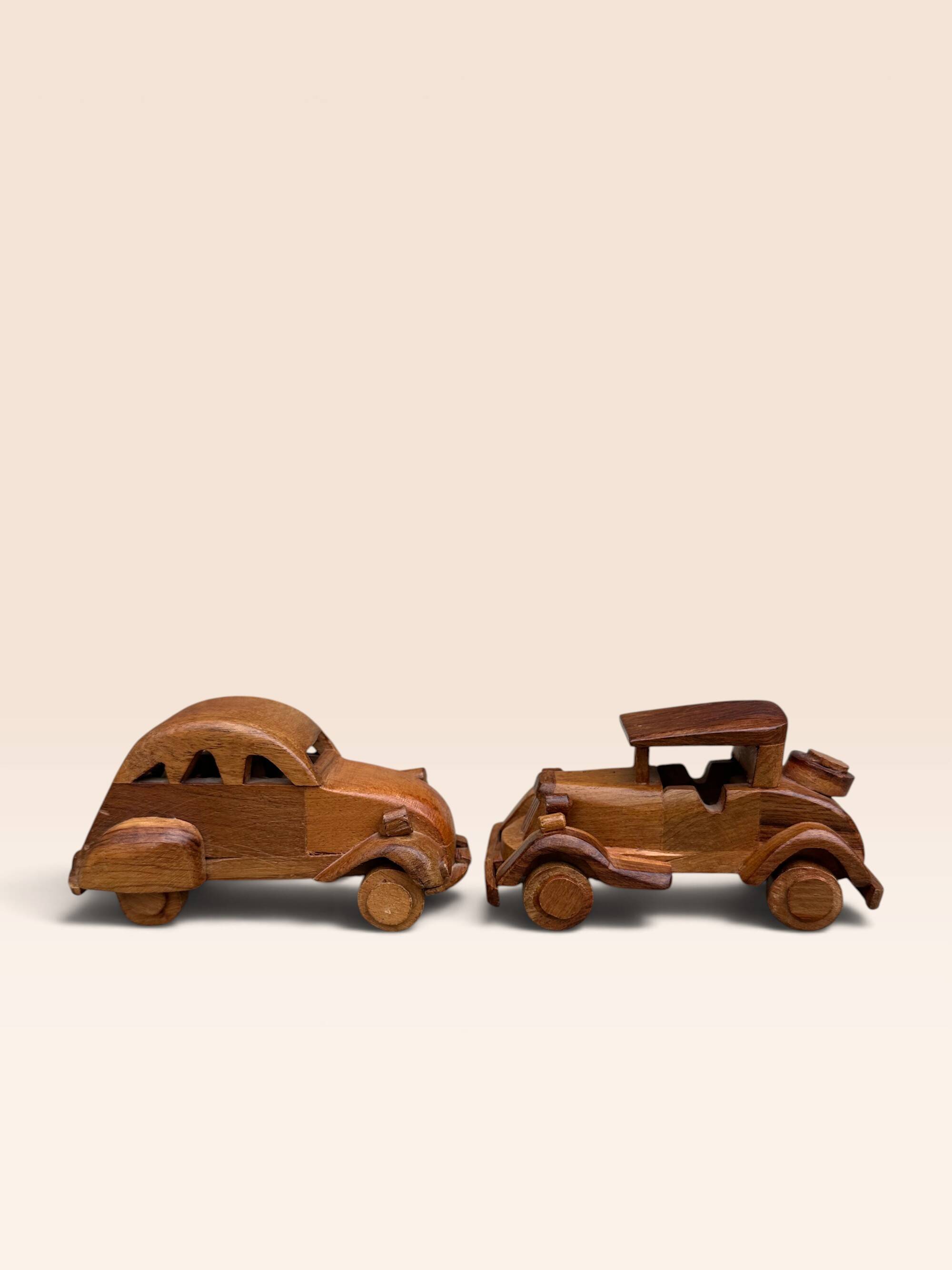 Pair of small handcrafted wooden cars