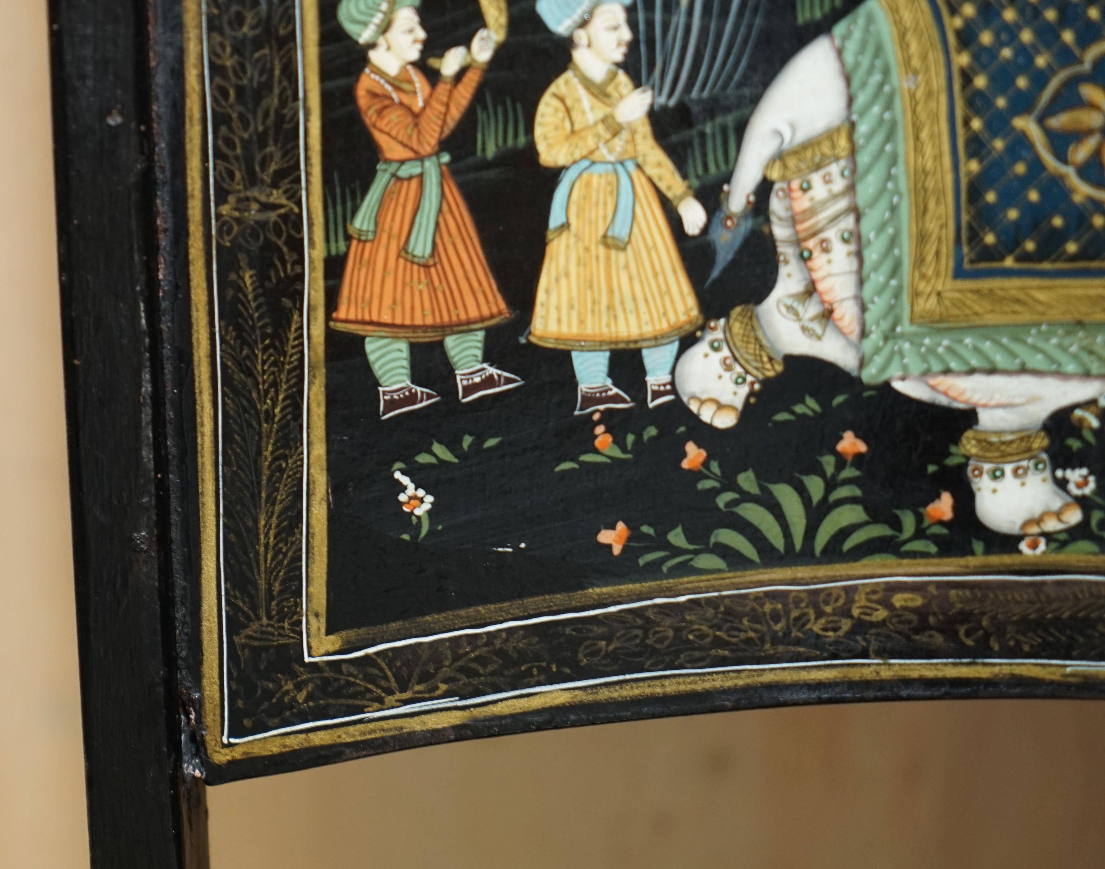 Pair of military folding chairs with Indian decoration.