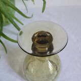 Footed glass made of blown glass