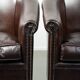Set of two cowhide club armchairs in good condition with a English design