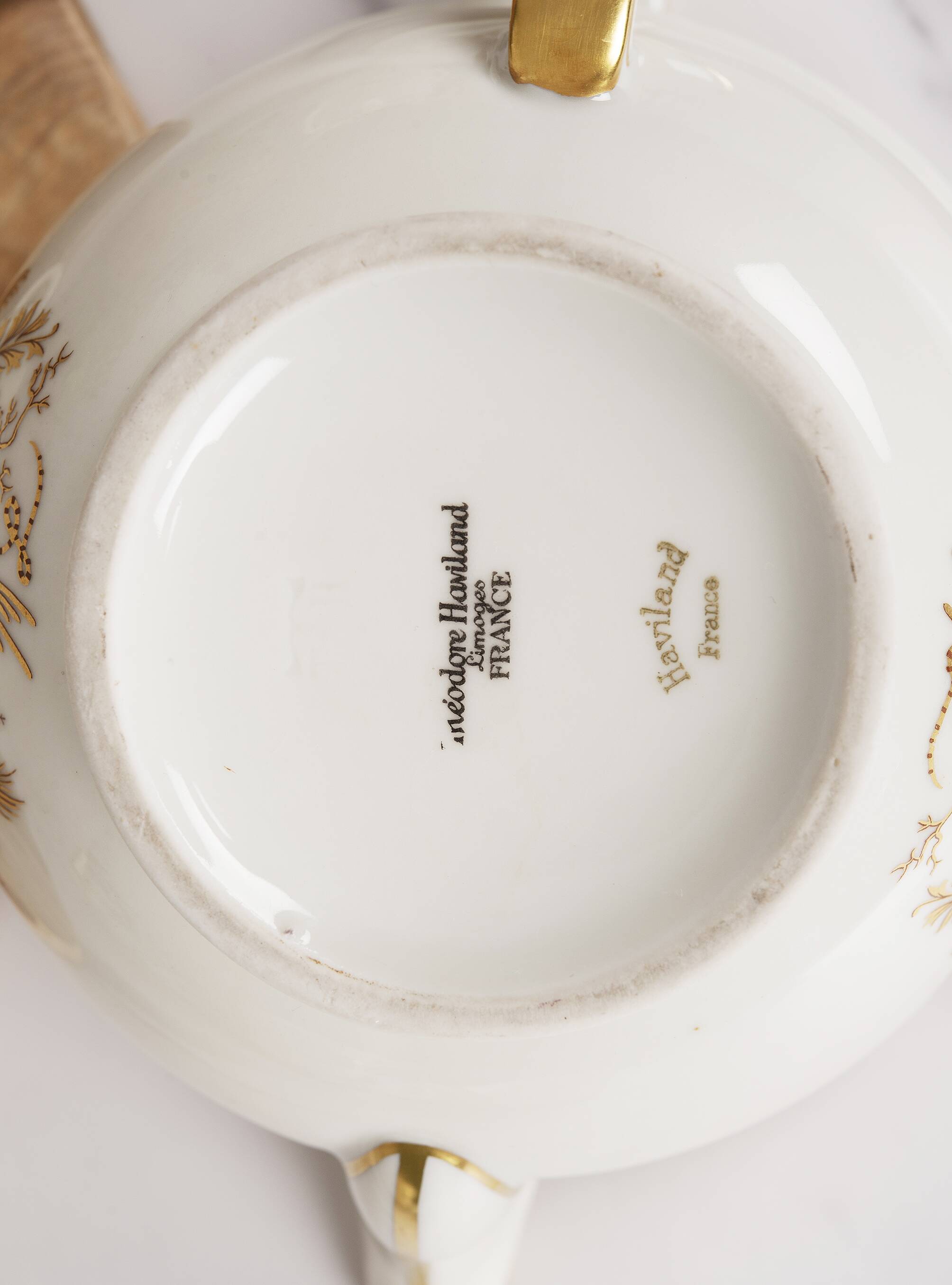 Porcelain tea service by Théodore Haviland, gilded patterns.