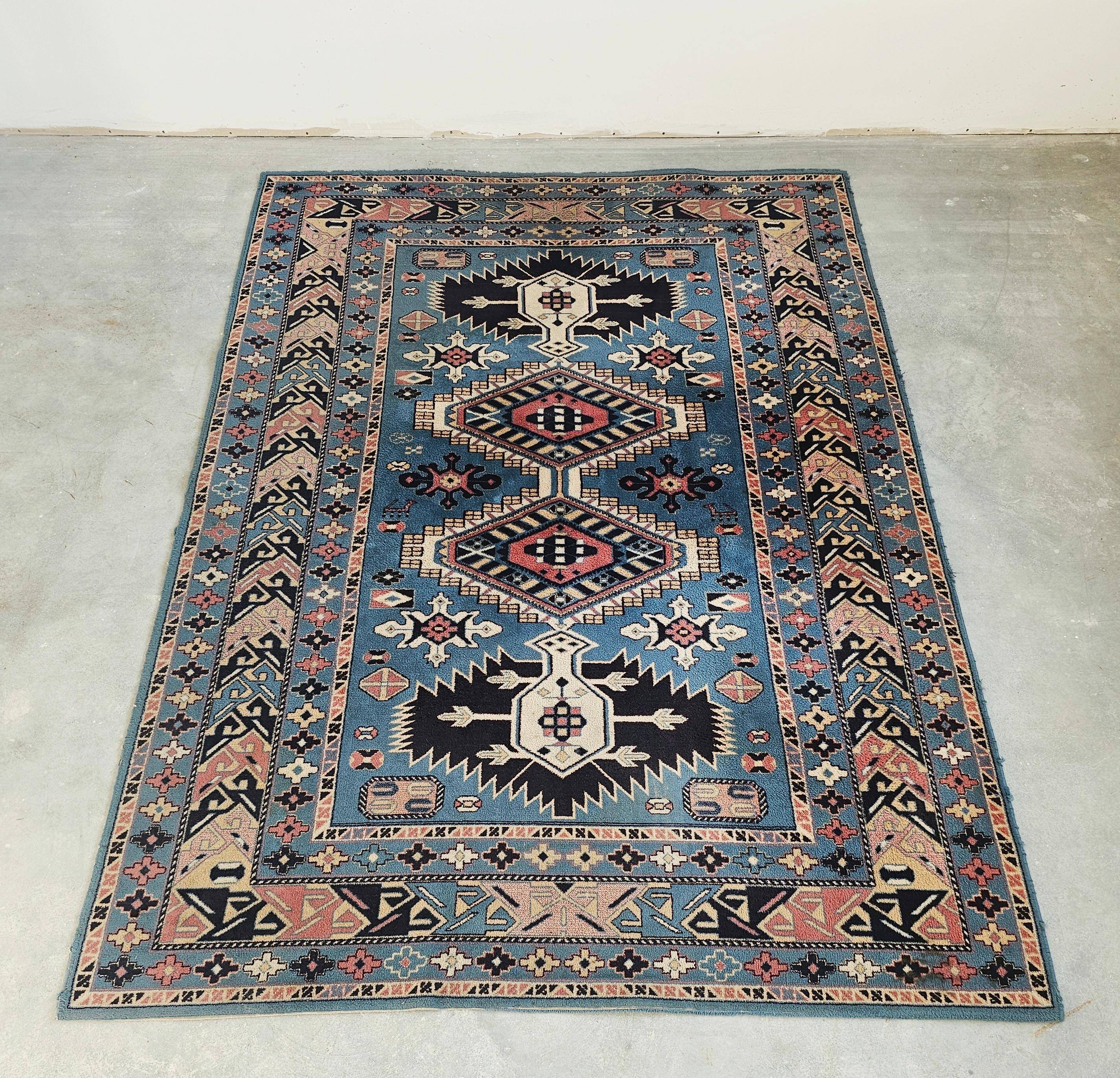 Vintage Kazak rug with geometric oriental motifs, 100% wool.