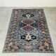 Vintage Kazak rug with geometric oriental motifs, 100% wool.