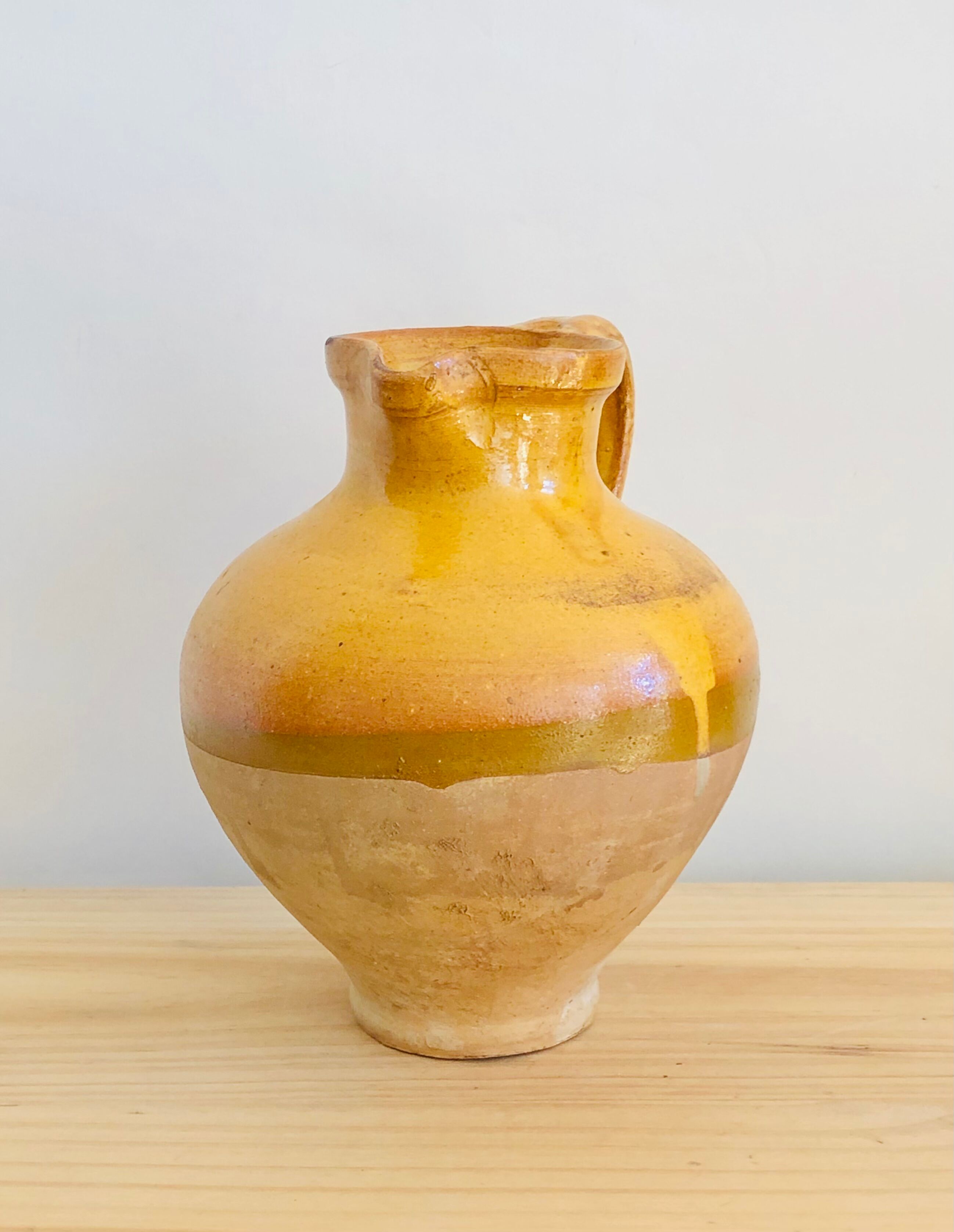 Vintage jug in glazed earth
