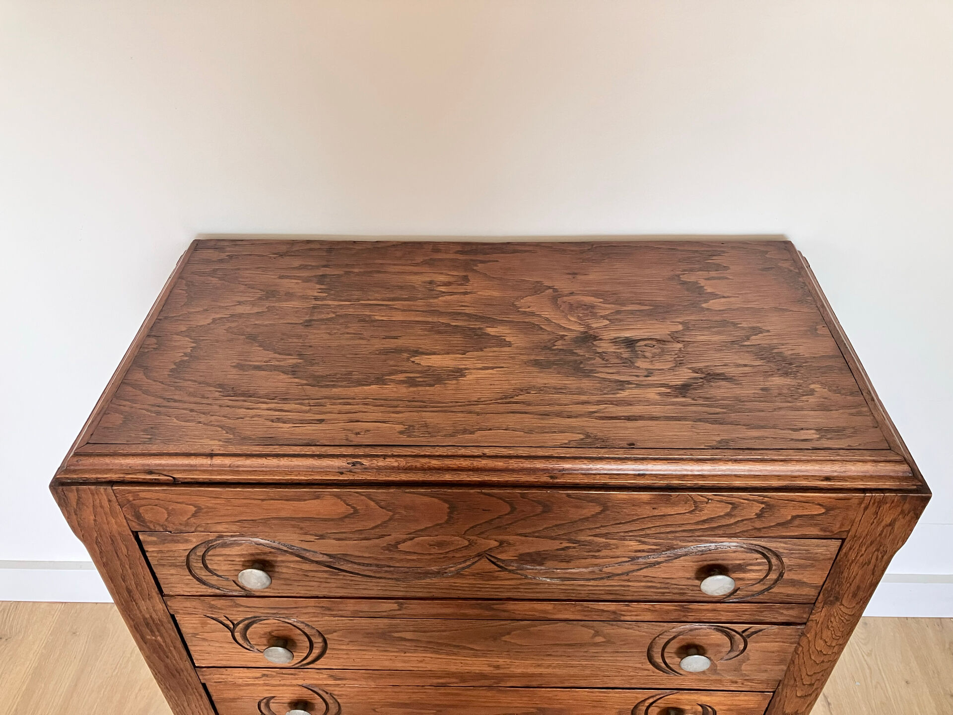 Antique commode with carved relief
