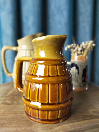 Two pitchers and a small original king beer mug