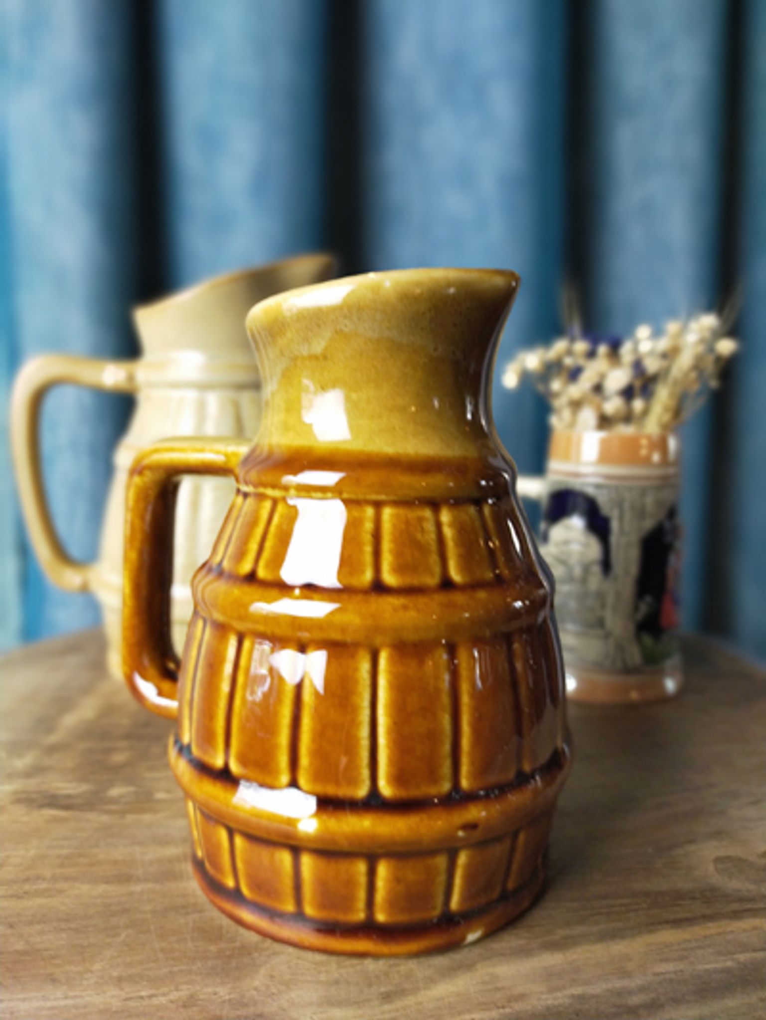 Two pitchers and a small original king beer mug