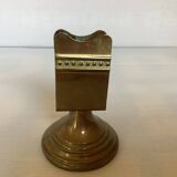Antique brass match holder with tulip base.