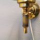 Older wall lamp, in metal, brass and milk-white glass