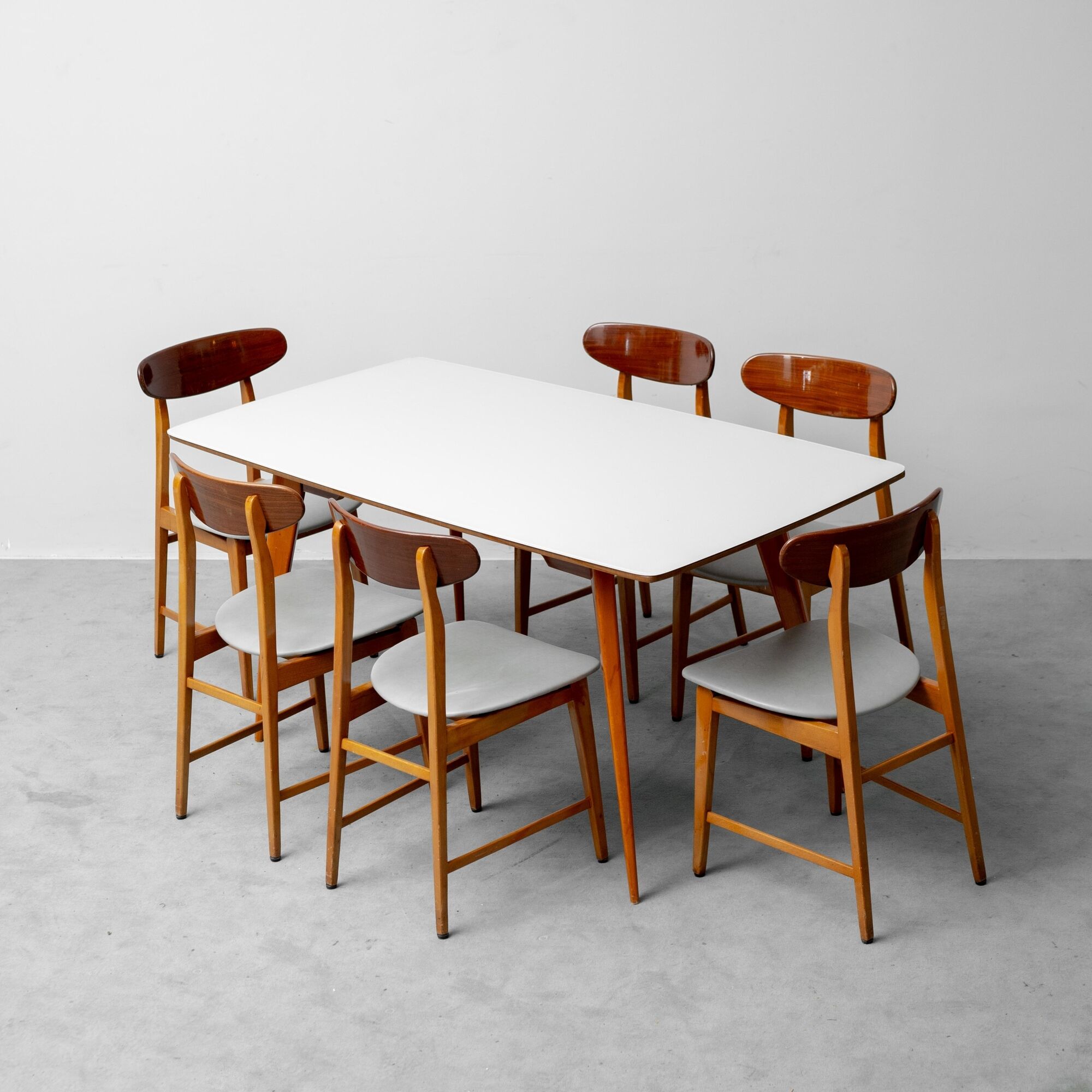 Vintage dining table set with 6 wooden chairs from the 1960s modernism