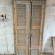 Wooden louvered wardrobe
