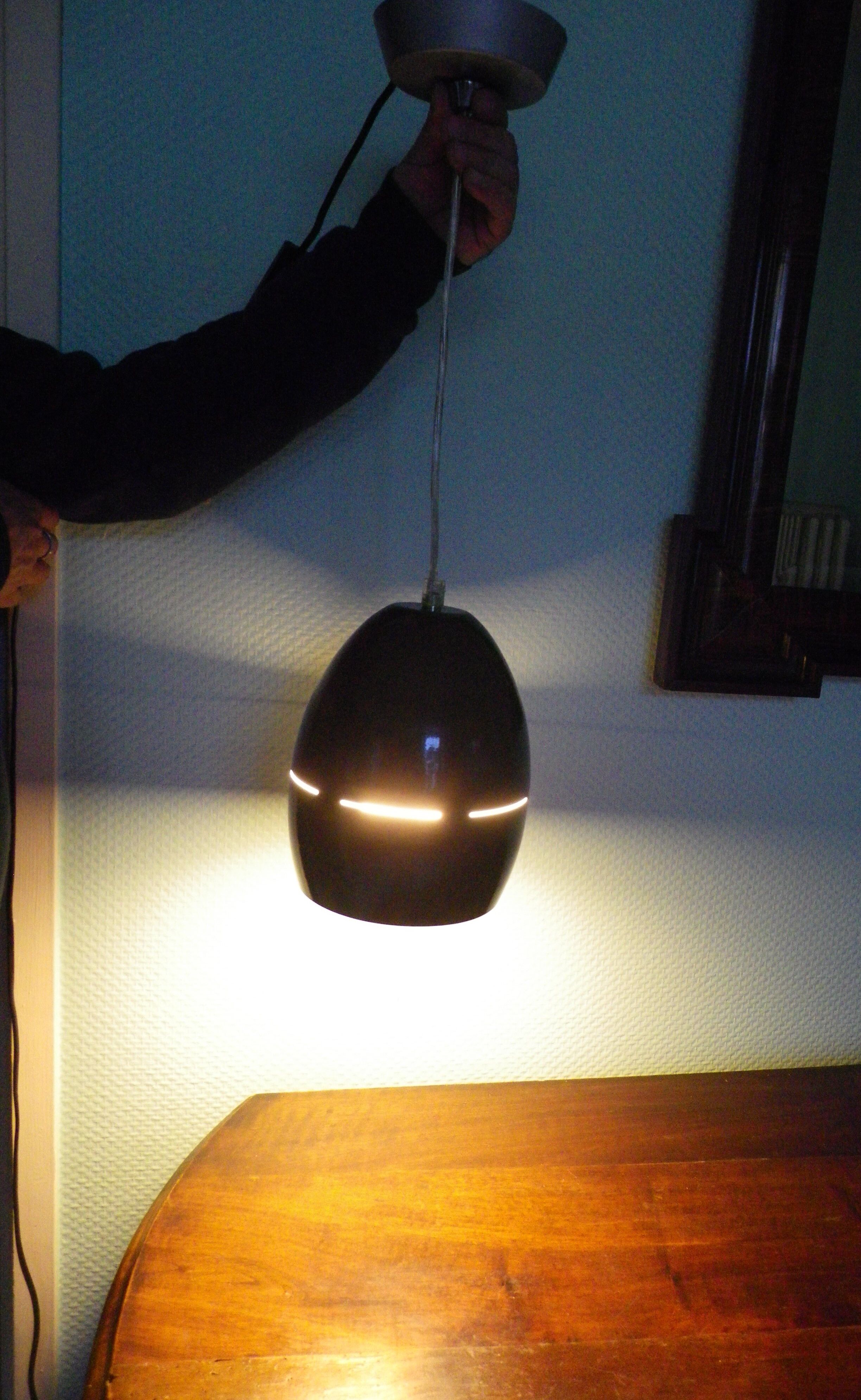 Space age style pendant lamp in openwork black metal